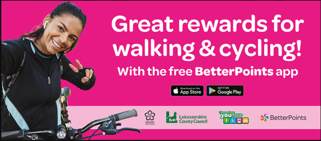 A woman posing for a photo on a bike next to white text reading: 'Great rewards for walking & cycling! With the free BetterPoints app' and app store icons.