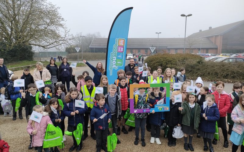 school children pose together in a group as they take part in park and stride