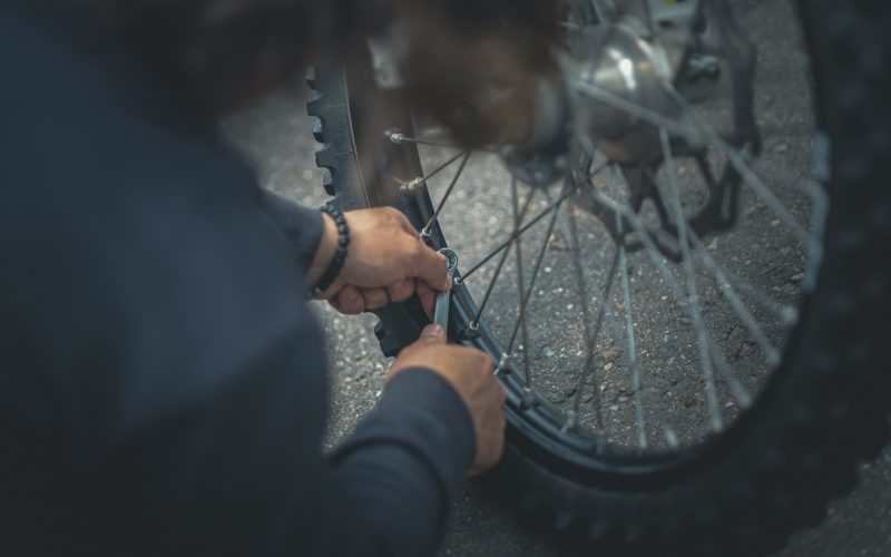 a person repairing a bike for the Hinckley and Bosworth Legacy Grants submissions