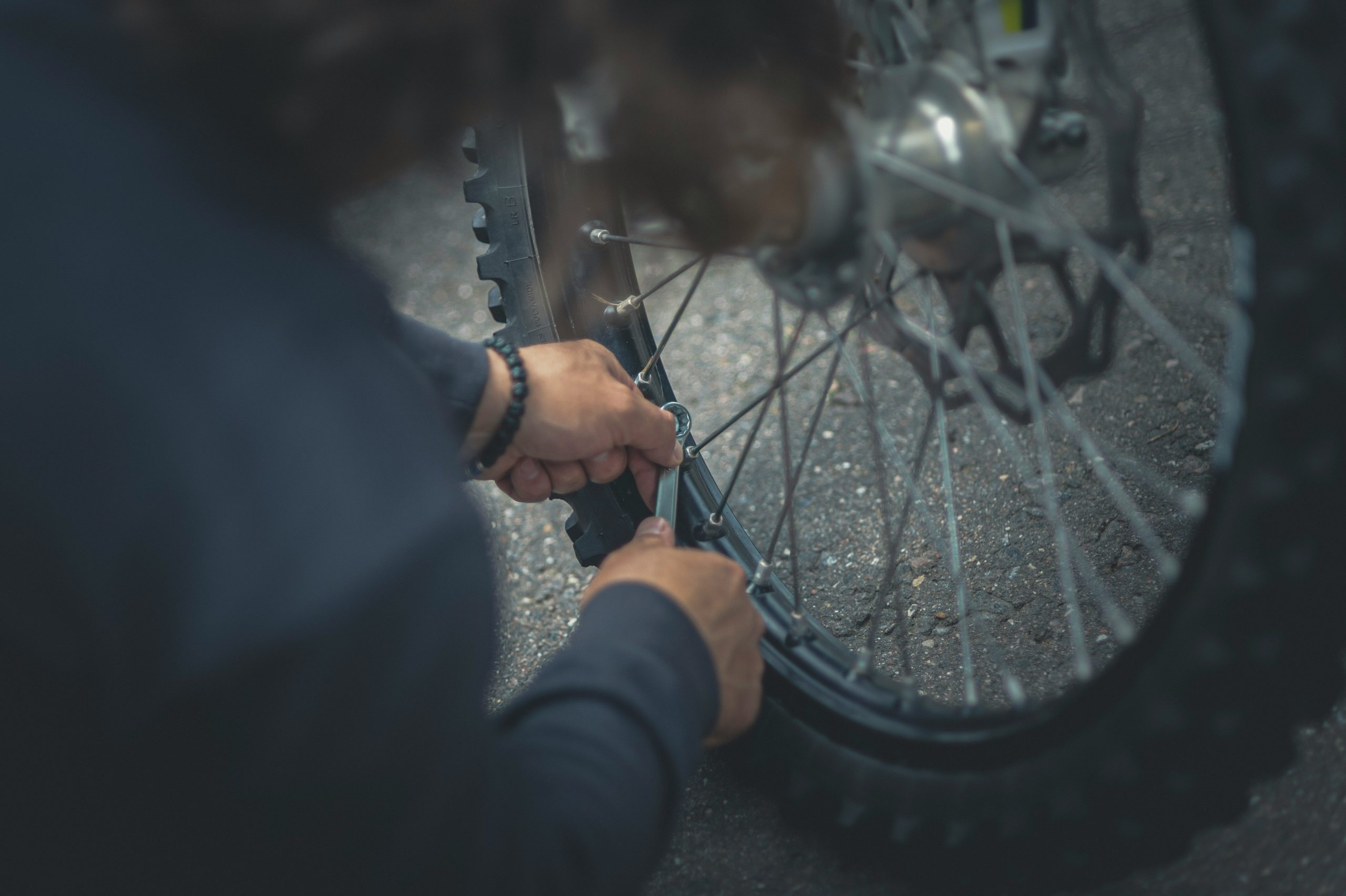 a person repairing a bike for the Hinckley and Bosworth Legacy Grants submissions