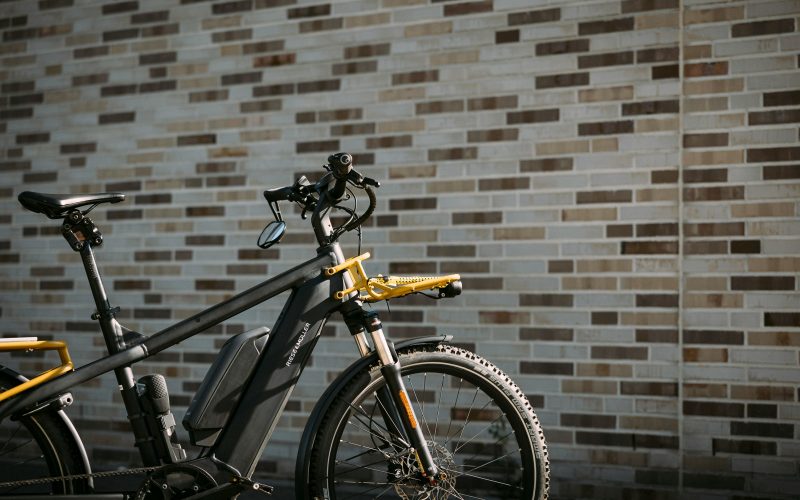 a bike in front of a brick wall