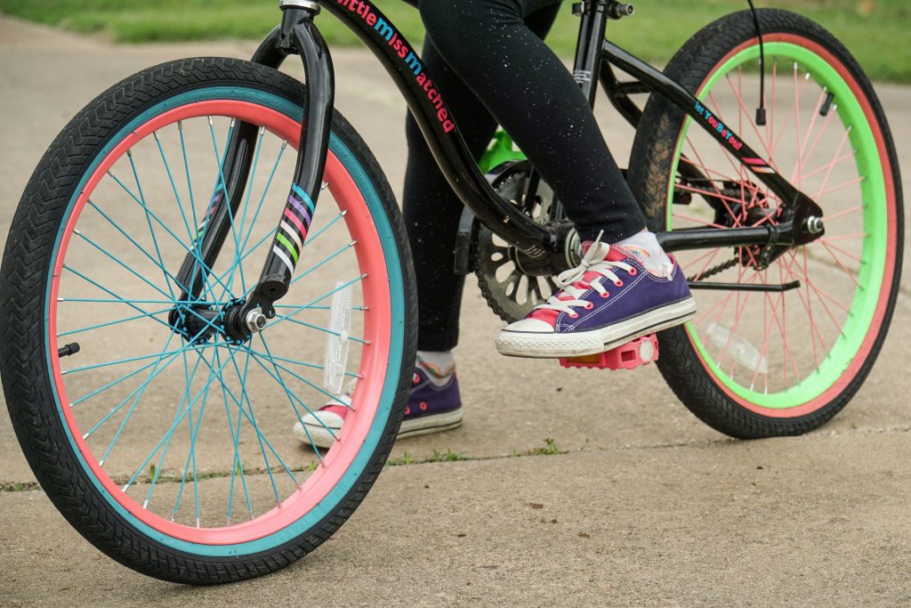 A child on a green and pink bike - for Leicestershire Bike Bank and Active Travel Calendar