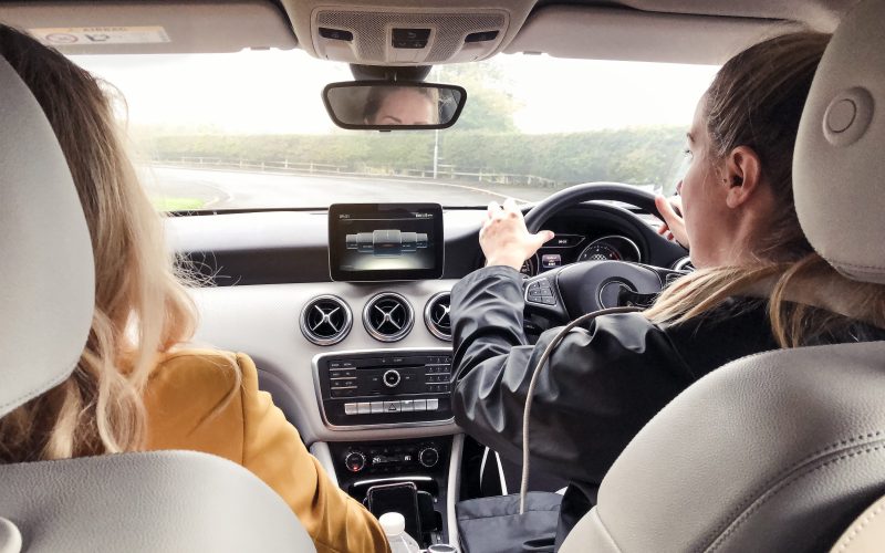 two people sat in a car