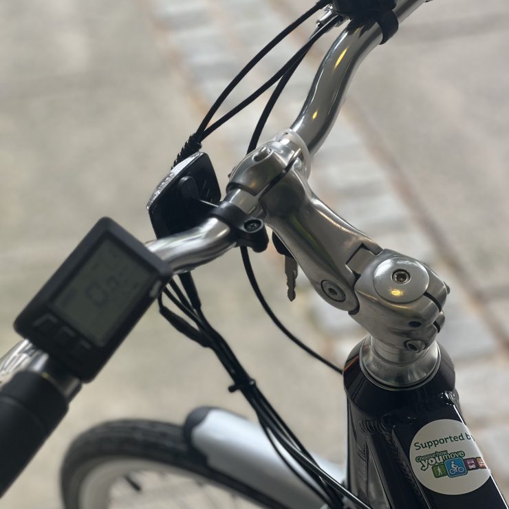 Close up of E-Bike showing support by Choose How You Move sticker
