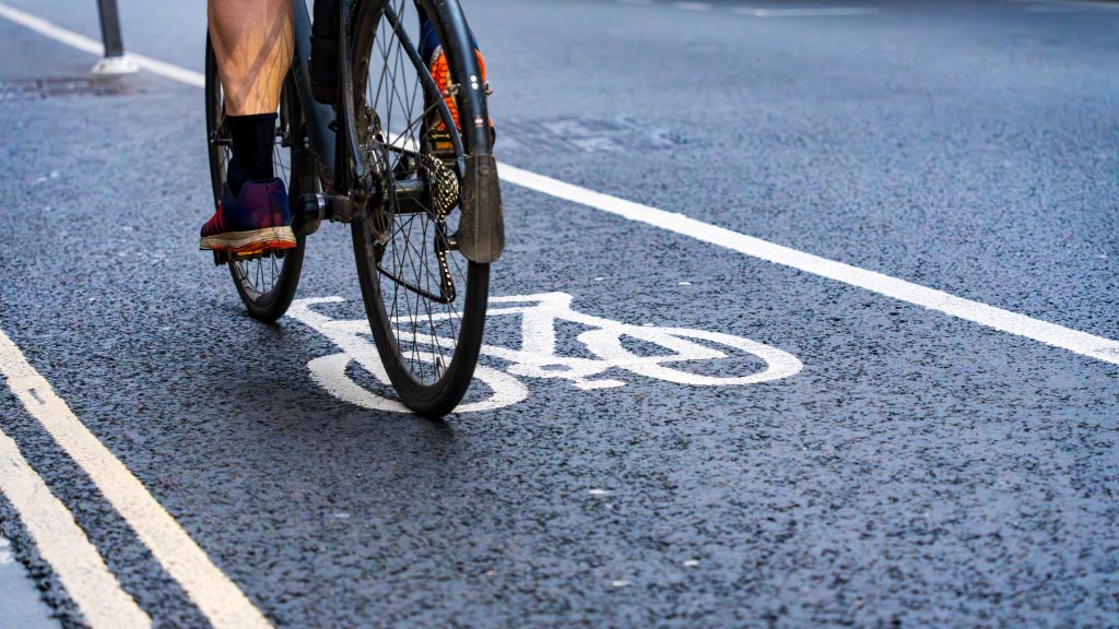 Cyclist riding in a bike lane in the city.