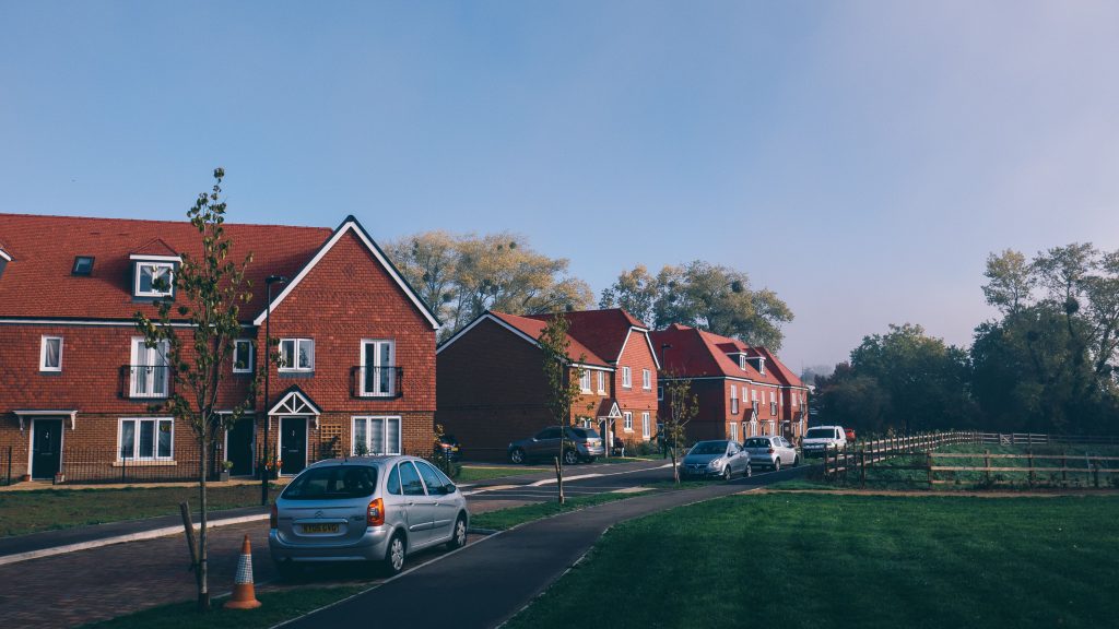 Cars parked in a suburban housing estate in the UK. For driving, car sharing, and road safety.