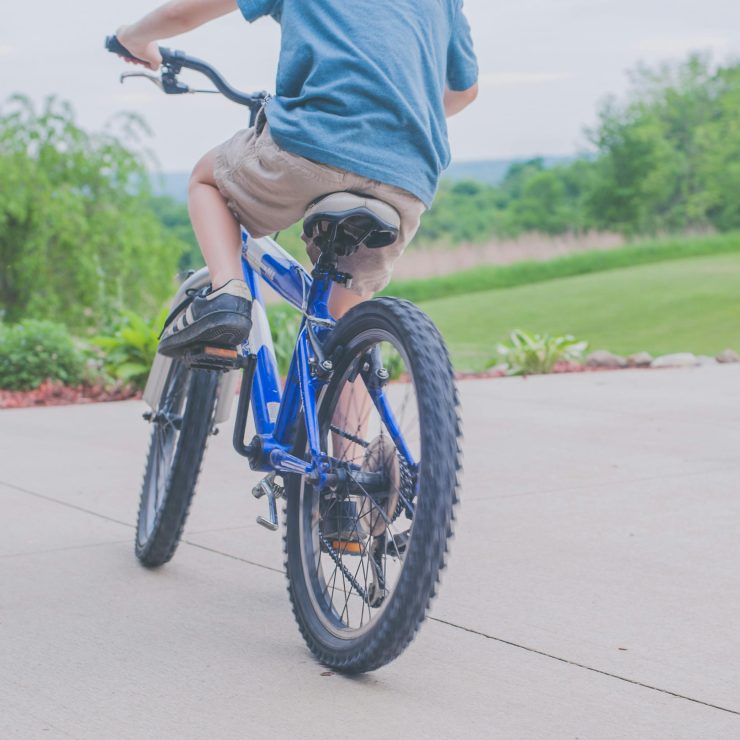 A boy riding a blue bike - for schools, the Active Travel Schools Calendar, the Leicestershire Bike Bank