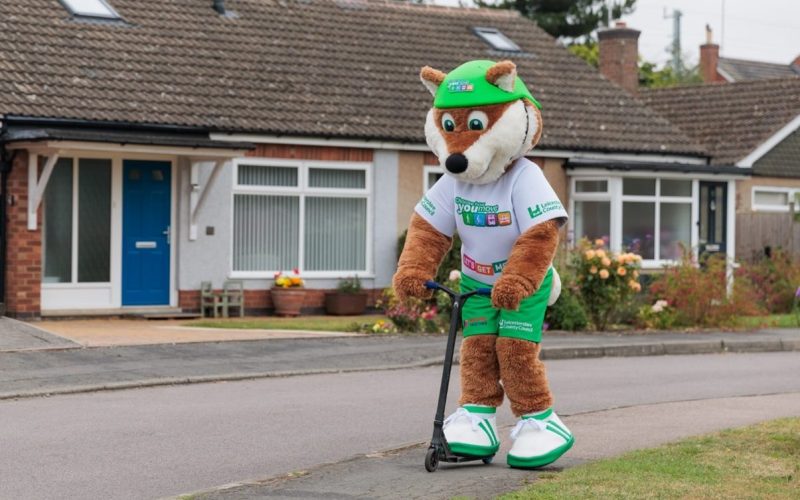 choose how you move fox mascot on a scooter