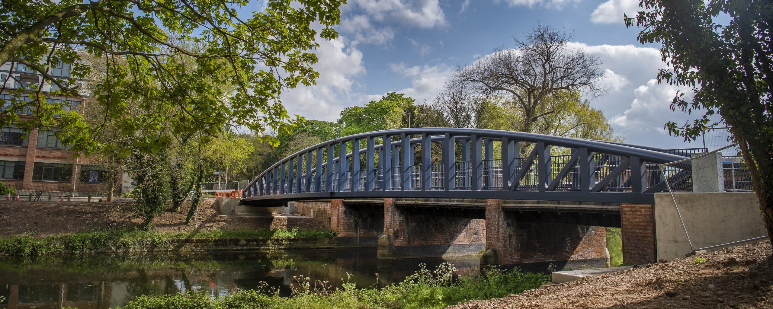 An outdoor space in Leicester city centre, a bridge going over the River Soar.