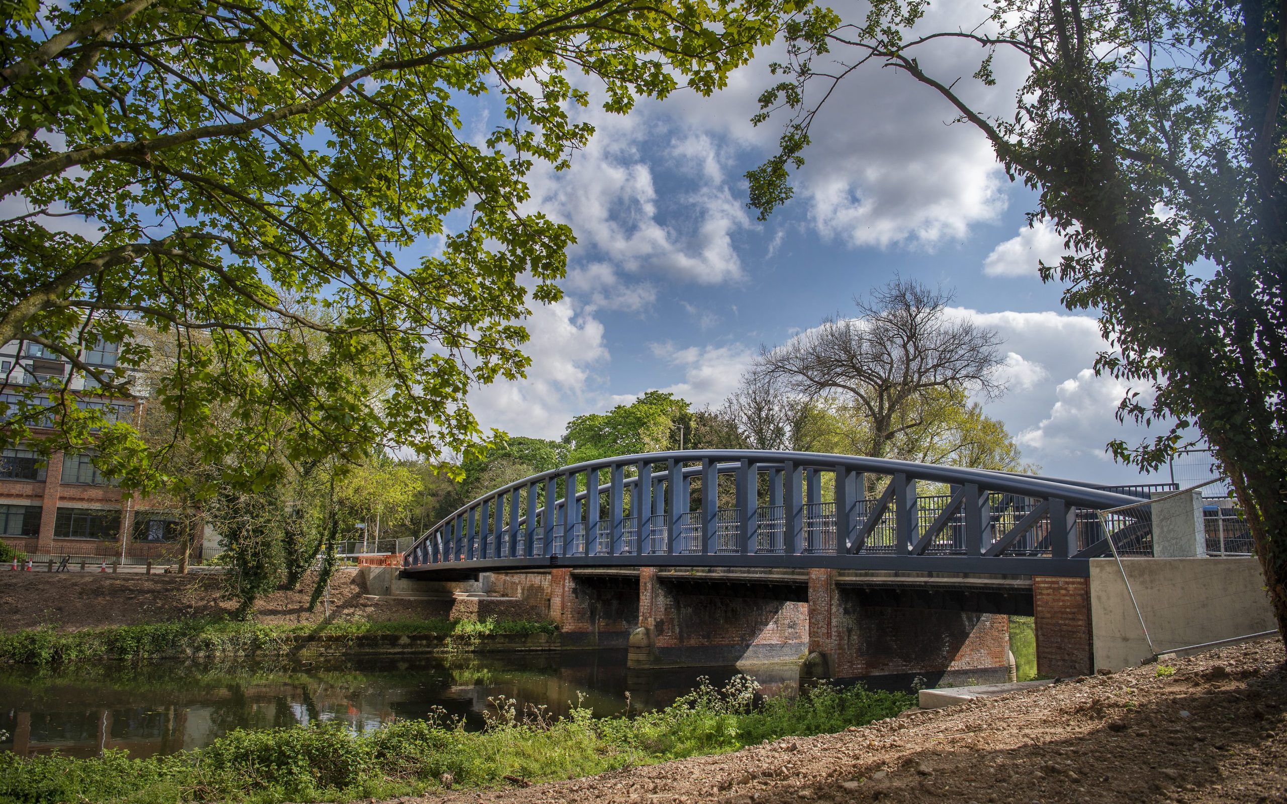 An outdoor space in Leicester city centre, a bridge going over the River Soar.