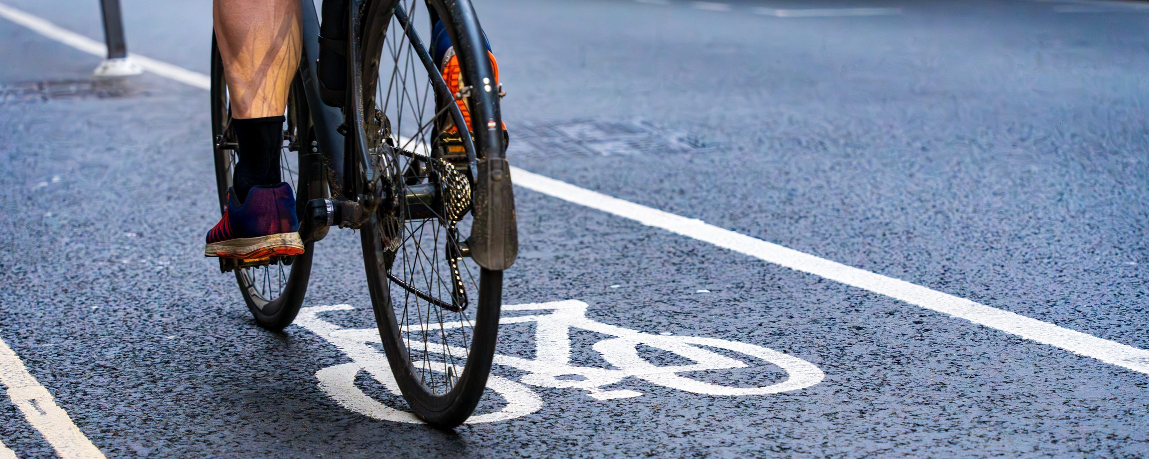 Cyclist riding in a bike lane in the city.