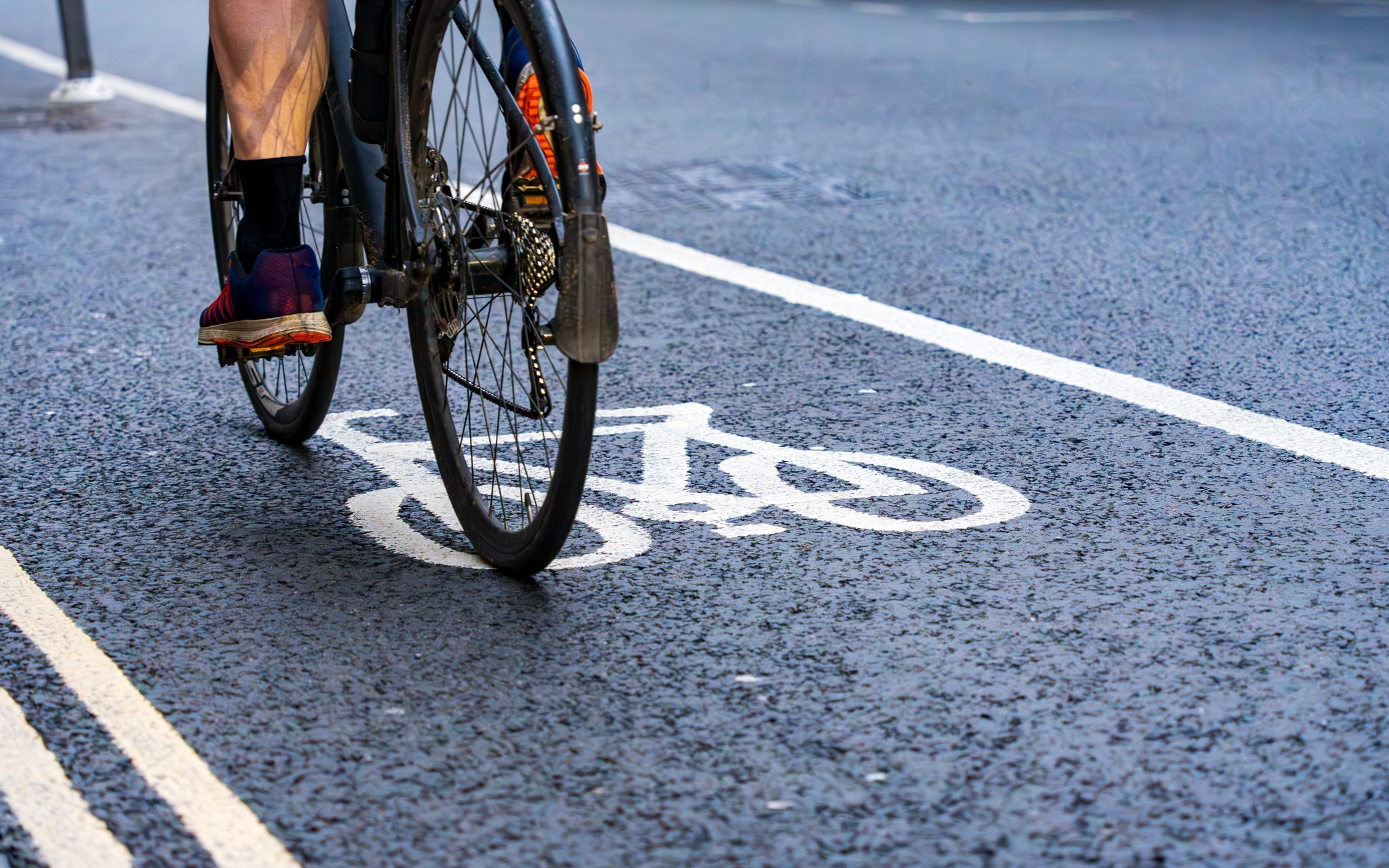 Cyclist riding in a bike lane in the city.