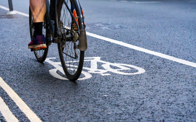 Cyclist riding in a bike lane in the city.