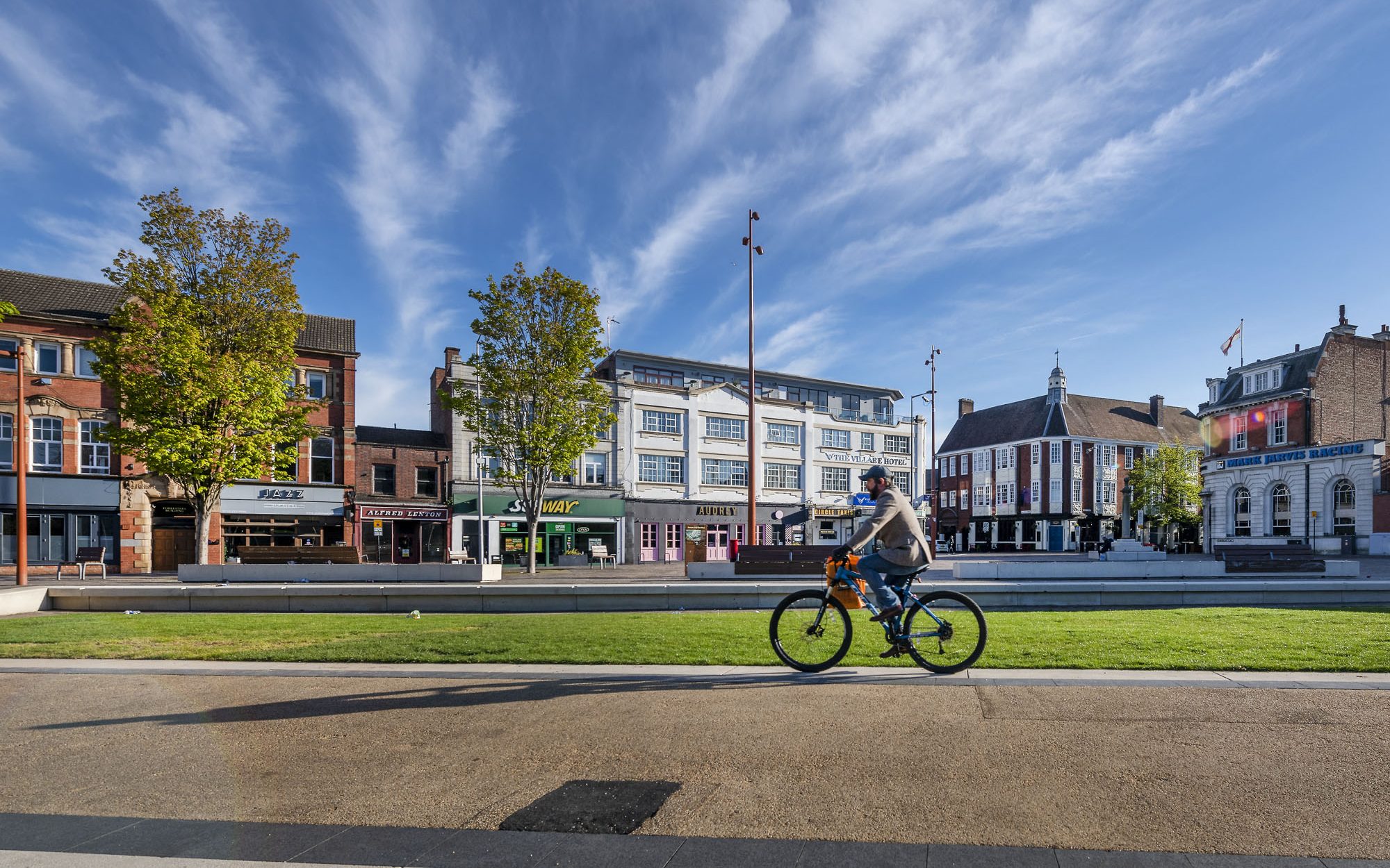 Person cycling through Jubilee Square, Leicester city centre.