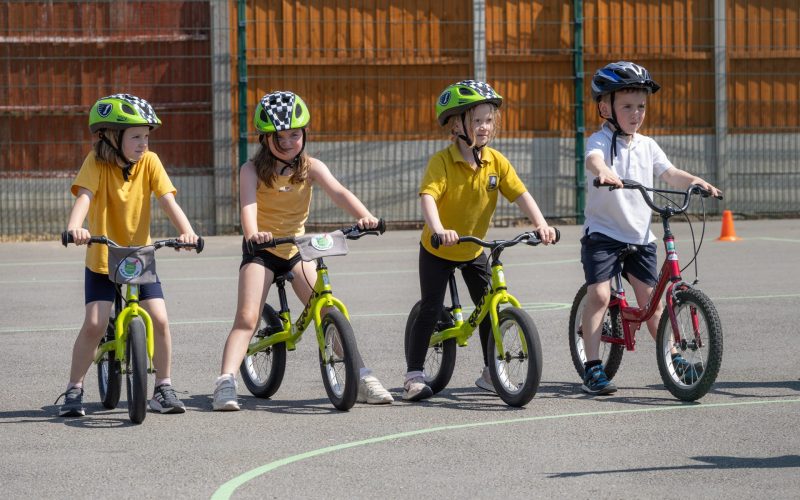 Children on scooters taking part in safety training