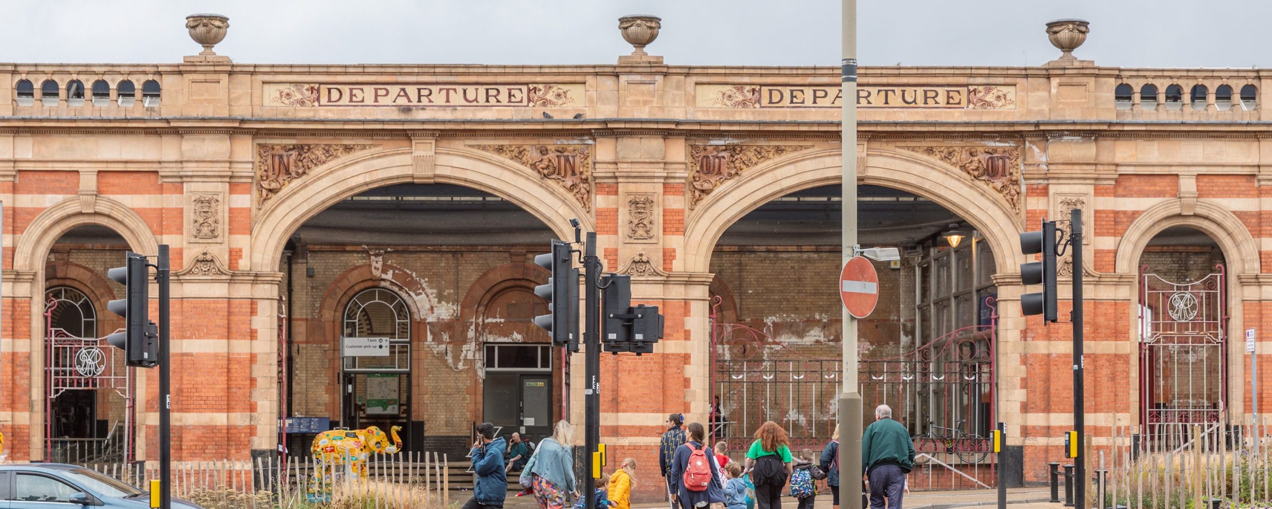 People walking to Leicester Railway Station in the city centre.