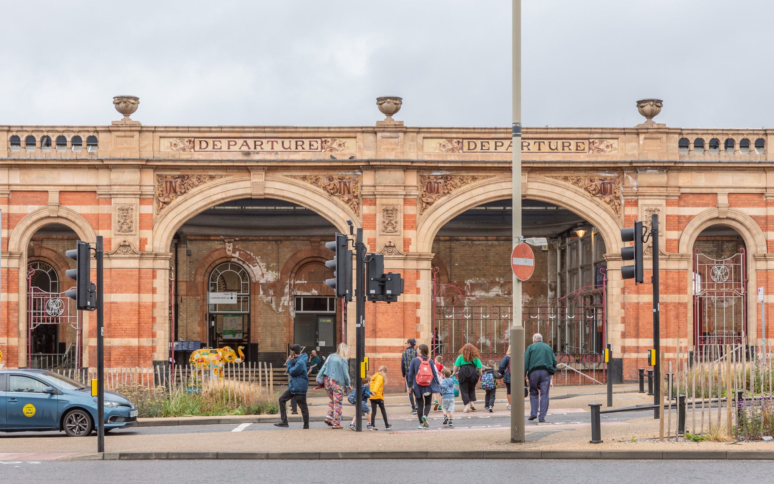 People walking to Leicester Railway Station in the city centre.